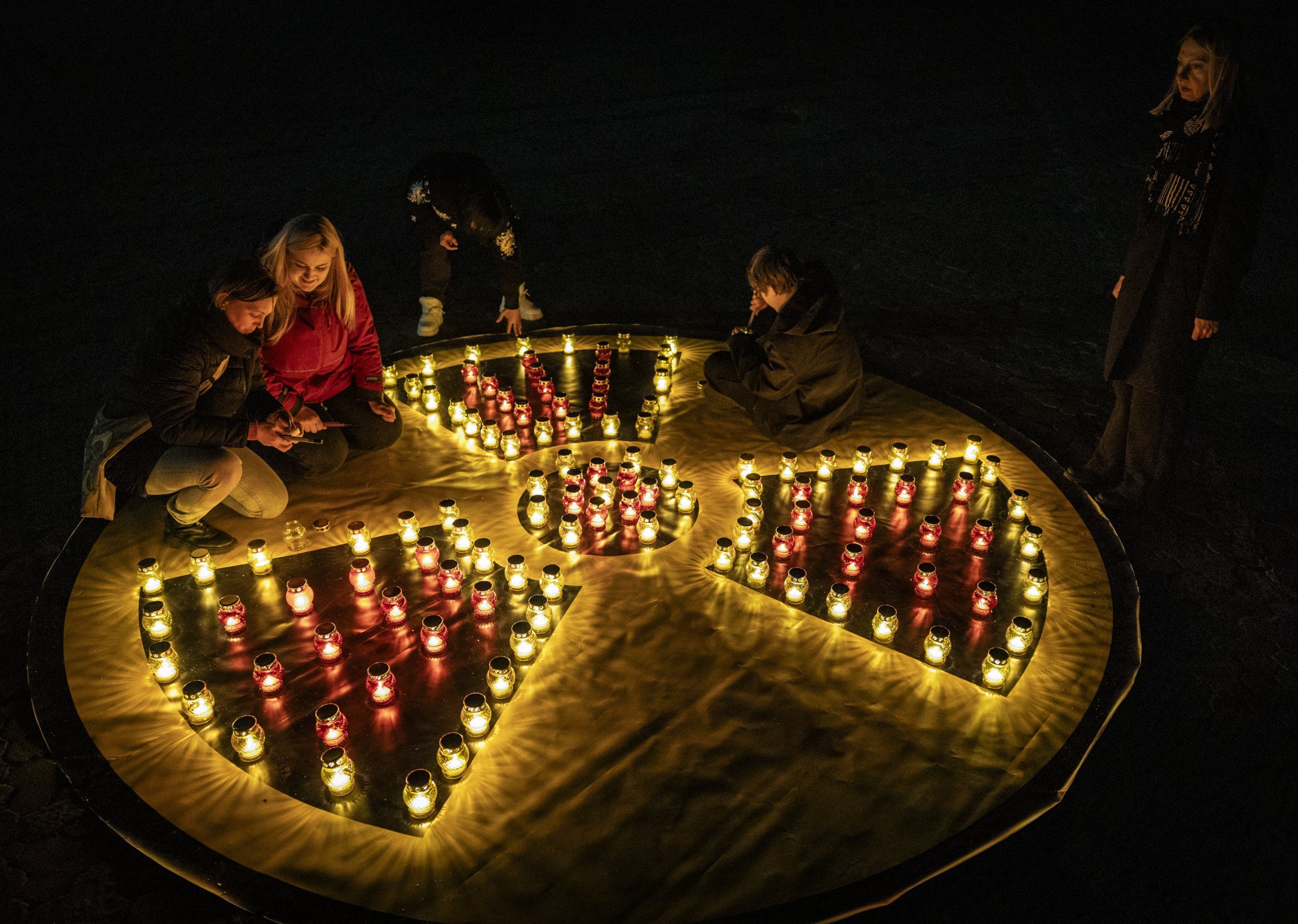 Attendees don hazmat suits for eerie vigil marking 40th anniversary of Chernobyl