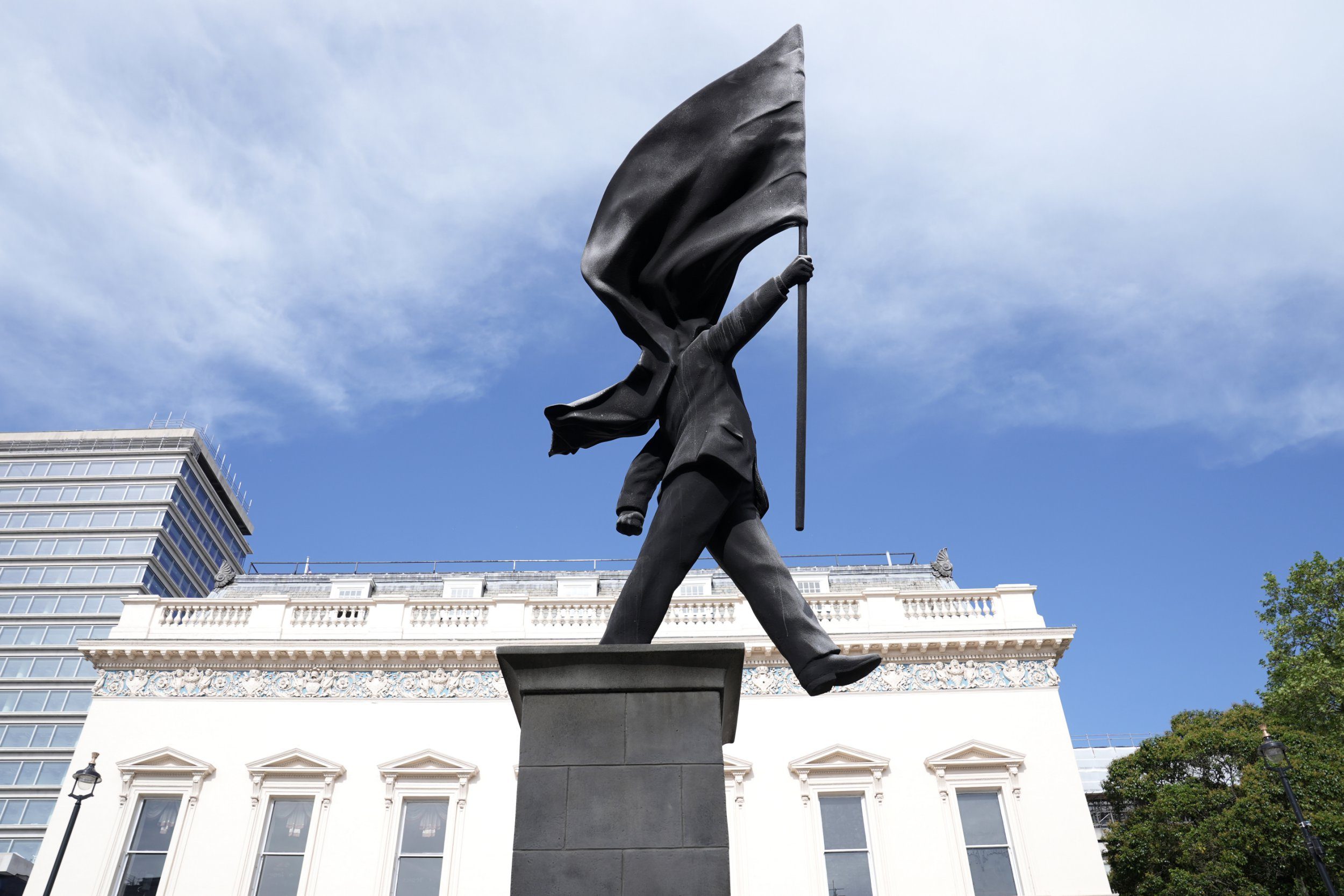 Is Banksy back? Mystery statue of man covered by a flag appears in London