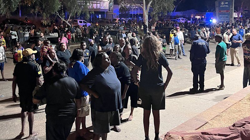 Chaos erupts as angry crowds surround Alice Springs hospital after fugitive's arrest